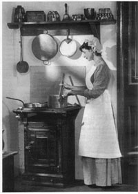 Woman cooking on gas stove